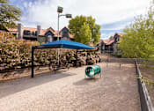 Thumbnail 80 of 87 - a playground with a blue tent and a green chair     and houses
