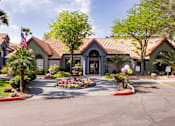 Thumbnail 83 of 87 - the front of a house with a driveway and trees and plants