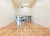 Thumbnail 51 of 87 - a large room with a racquetball court and a wooden floor