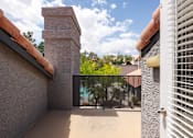 Thumbnail 40 of 87 - a balcony with a view of a pool and a gate