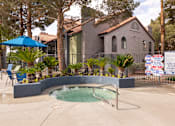 Thumbnail 57 of 87 - a hot tub in a pool in front of a house
