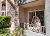 Thumbnail 25 of 43 - the front porch of an apartment building with a swing on it