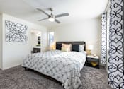 Thumbnail 10 of 43 - a bedroom with a bed and a ceiling fan