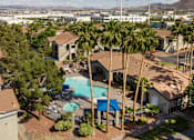 Thumbnail 42 of 54 - a house with a swimming pool and palm trees