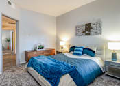 Thumbnail 22 of 54 - a bedroom with a bed and a closet