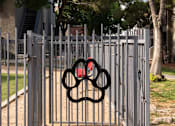 Thumbnail 48 of 54 - a gate with a olympic symbol on it in front of a fence