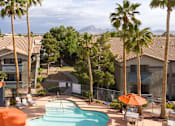 Thumbnail 36 of 47 - an aerial view of a pool at the resort with palm trees