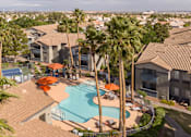 Thumbnail 37 of 47 - an aerial view of a swimming pool with palm trees