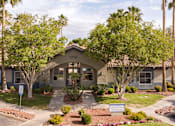 Thumbnail 28 of 47 - an exterior view of a building with palm trees