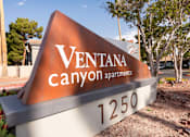 Thumbnail 27 of 47 - a sign that says ventana canyon apartments in front of a street