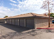 Thumbnail 46 of 47 - a parking lot with a row of garage doors