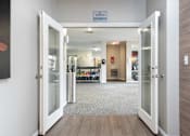 Thumbnail 32 of 47 - a view of a lobby with open doors and a wall with a bike rack