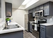 Thumbnail 5 of 36 - our apartments offer a modern kitchen with stainless steel appliances