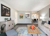 Thumbnail 2 of 36 - a living room with couches and chairs and a floor lamp