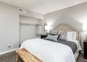 Thumbnail 10 of 36 - A picture of a bedroom and closet in an apartment