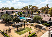 Thumbnail 32 of 36 - an aerial view of a park with a tennis court and a pool