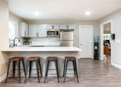 Thumbnail 25 of 36 - A picture of a kitchen in an apartment