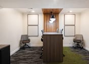 Thumbnail 38 of 42 - a conference room with a wooden desk and chairs