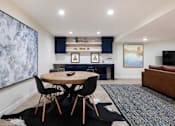 Thumbnail 36 of 42 - a living room and dining room with a table and chairs