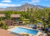 Thumbnail 1 of 42 - an aerial view of a swimming pool with mountains in the background
