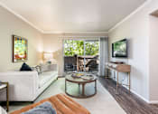Thumbnail 3 of 42 - a living room with a couch and a table