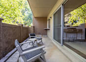 Thumbnail 13 of 42 - a patio with two chairs and a table on a balcony