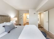 Thumbnail 8 of 42 - a bedroom with a large bed and a closet