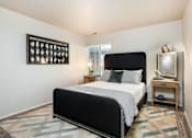Thumbnail 10 of 42 - the bedroom has a large bed and a large window