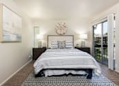 Thumbnail 20 of 42 - a bedroom with a bed and a window