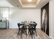 Thumbnail 17 of 42 - a dining room with a table and chairs and a large wall mural of an elephant