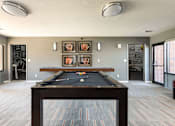 Thumbnail 30 of 38 - a room with a pool table in the middle of it