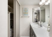 Thumbnail 8 of 38 - a bathroom with a sink and a mirror