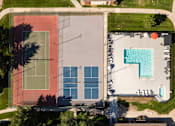 Thumbnail 11 of 38 - arial view of a building with a pool on the side of it