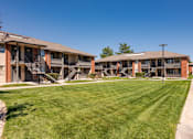 Thumbnail 33 of 38 - a row of apartments with balconies and a lawn