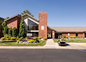 Thumbnail 1 of 38 - a building with a golf cart parked in front of it