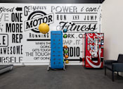 Thumbnail 24 of 38 - a room with two vending machines and a wall with graffiti on it