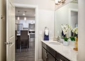 Thumbnail 17 of 42 - a bathroom with a sink and a mirror