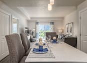 Thumbnail 14 of 42 - a dining room table with chairs in a living room