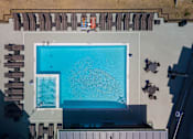 Thumbnail 24 of 42 - arial view of a swimming pool on the roof of a building