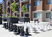 Thumbnail 25 of 42 - a giant chess board in front of an apartment building