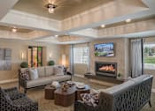 Thumbnail 30 of 42 - a living room with a couch and a fireplace