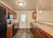 Thumbnail 2 of 9 - Kitchen at Benson Village Townhomes Apartments, Sioux Falls, SD