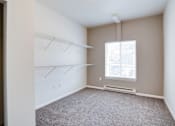 Thumbnail 7 of 10 - Carpeted Bedroom at Urban Crossing Apartments, Fargo, North Dakota
