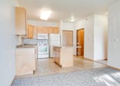 Thumbnail 5 of 9 - Kitchen with white appliances at Lakestone Apartments, Moorhead, MN