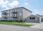 Thumbnail 12 of 12 - a large apartment building with balconies and a sign that reads condominium  at Courtyard Apartments, Moorhead, 56560