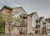 Thumbnail 14 of 15 - A large apartment complex with multiple balconies and garages, Eighth Street Manor  Apartments, Fargo, ND