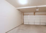 Thumbnail 8 of 10 - A white garage door is closed.