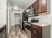 Thumbnail 4 of 11 - Kitchen with Stainless Steel Appliances at Graystone Townhomes, Sioux Falls, South Dakota