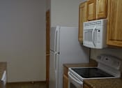 Thumbnail 4 of 9 - Fully Equipped Kitchen at Courtyard Townhomes, Moorhead, Minnesota