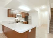 Thumbnail 2 of 10 - Fully Equipped Kitchen at Prairie Crossing Townhomes, Dilworth, MN, 56529